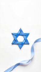 Blue Star of David Decoration with Ribbon on White Background  