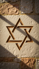 Star of David carved into stone wall with shadows  