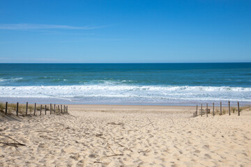 Sandy wooden pathway access in summer to beach le grand crohot in lege cap ferret sea atlantic...