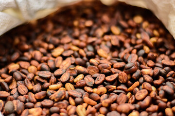 In the honey process, coffee beans are dried under the sun. As the pulp and mucilage ferment, they give the beans a yellowish-brown color.