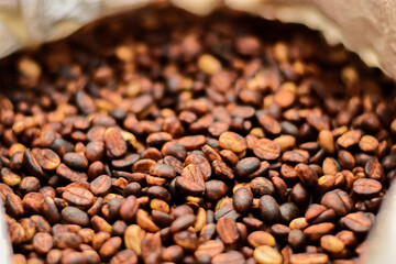 In the honey process, coffee beans are dried under the sun. As the pulp and mucilage ferment, they give the beans a yellowish-brown color.