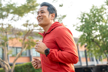 Obraz premium Senior old man runner exercise outdoor nature park. fitness man jogging wearing sportswear. Mature athlete man in sportswear Workout running at public park. Health and activity old man lifestyle