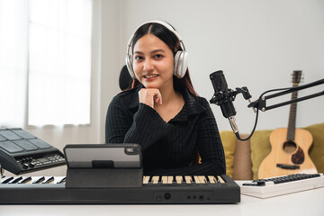 Professional Musician with condenser microphone and tablet for Mixing Mastering music. Music...