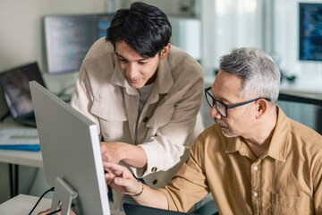 Group of asian senior learning programming software development analyzing  flowcharts  during a...