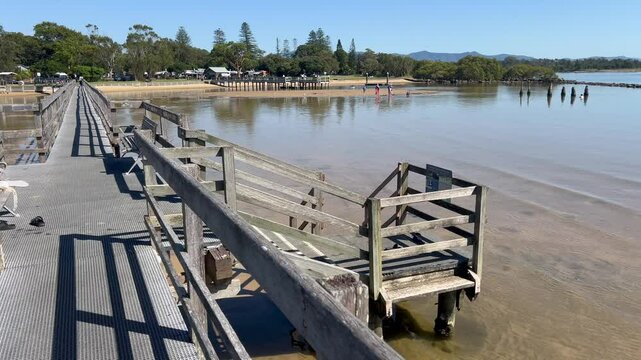Aerial drone landscape view of Urunga Wetlands wooden boardwalk in New South Wales Australia.