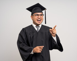 Various action. Happy Young Asian man in graduation costume with cap on isolated background....