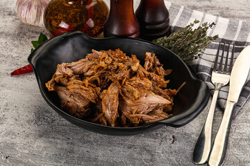Shredded slow cooked pork meat