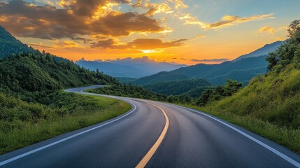 Naklejka premium A tranquil sunset scene with an empty highway and mountains covered in greenery, with clouds scattered across the sky.