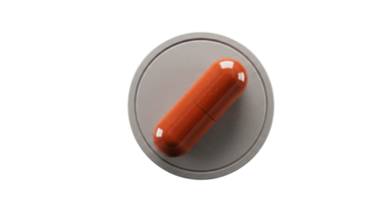Isolated Orange Capsule Pill on Gray Tablet