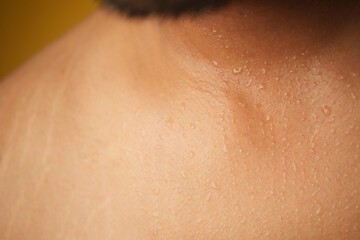 Close-up of shoulder skin with sweating after intense workout
