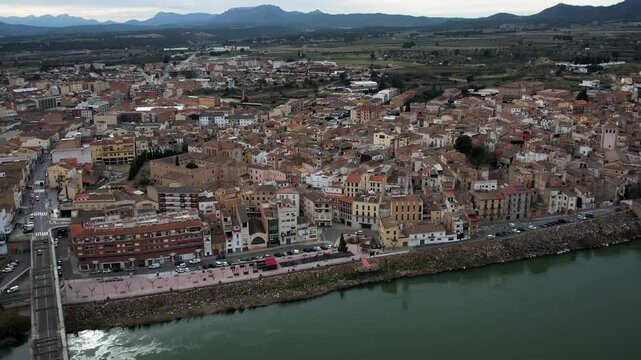 Mora de Ebro aerial view with village, river, and bridge in Catalonia, Spain. High quality 4k footage