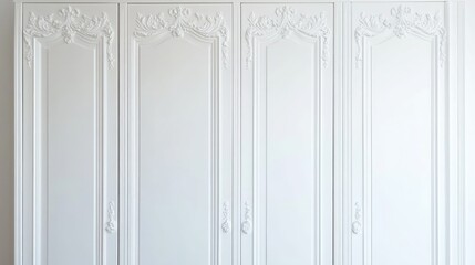 A vintage-inspired white wardrobe with ornate carvings and elegant handles.