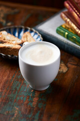 Cappuccino on dark wooden background. Soft focus. Close up.	
