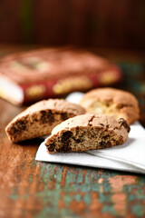 Cantuccini (Italian cookies) on dark wooden background. Close up	