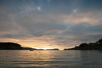 Sunset at a loch near a camping site in Sheildaig, Scotland.