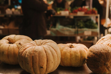 Freshly pumpkins grouped together in a tight frame, showcasing their vibrant green color. Shopping At Farmers Market Stall. Part of the series