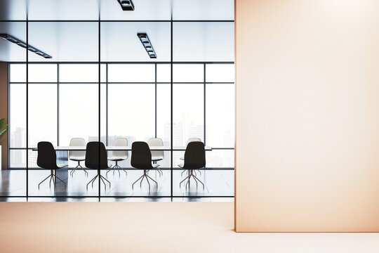 Modern office interior with glass-walled meeting room and large blank wall for poster or logo mockup in corporate workspace layout. 3D Rendering