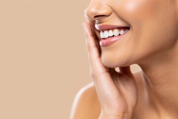 Obraz premium A woman smiling with her hand on her chin