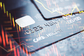 Credit and debit cards with financial graph overlay symbolizing banking crisis and digital finance...