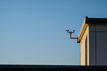 weather monitoring station on modern building.
