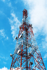 Radio, communication and cell towers on blue sky background