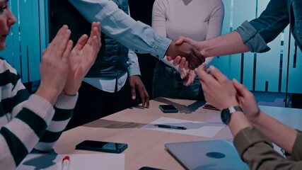 Business professionals shake hands in an office, sealing a successful agreement. A corporate meeting highlights teamwork, trust, and collaboration, welcoming a new employee and strengthening