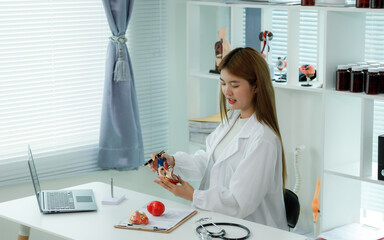 A female doctor who advises patients on heart health, disease prevention, and treatment, including...