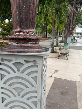 A decorative garden lamp post, featuring a unique patterned design.