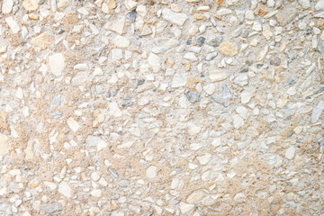 Weathered cement and gravel walls texture background