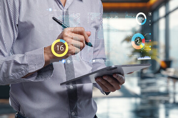 Modern Businessman Using Tablet with Data Visualization Elements