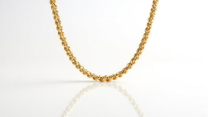 Beautiful gold necklace over white with reflection and copy space