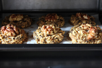 Homemade oat and banana cookies in the oven, dessert for vegan