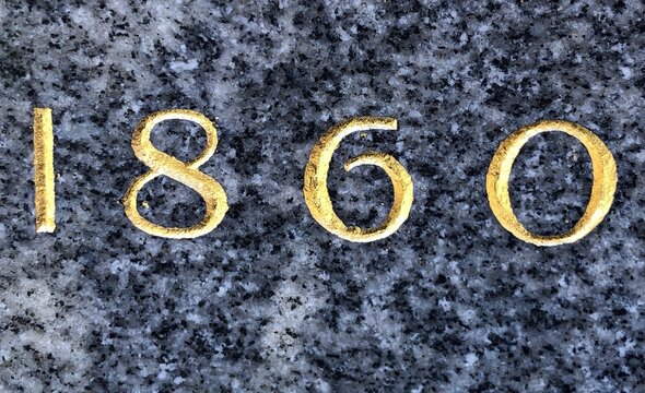 The year 1860 etched in marble with gold leaf