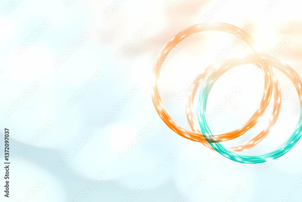 Poster overlapping circular graphics with rings and turquoise hues against a luminous background