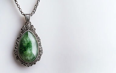 Elegant jade pendant on a silver chain.