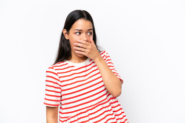 Young Colombian woman isolated on white background doing surprise gesture while looking to the side
