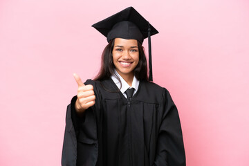 Young university Colombian woman graduate isolated on pink background with thumbs up because...