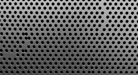 A detailed image of a metallic surface with several holes
