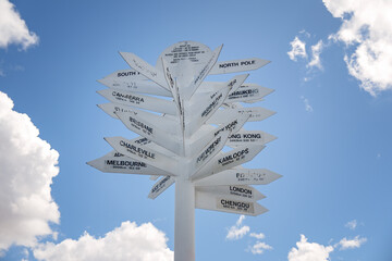 Signpost direction sign against blue sky, outback Australia Queensland Mount Isa, travel tourism destination