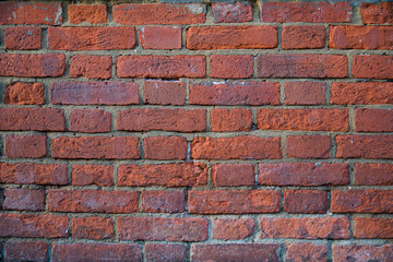 Traditional red brick wall, displaying a weathered and textured surface 10