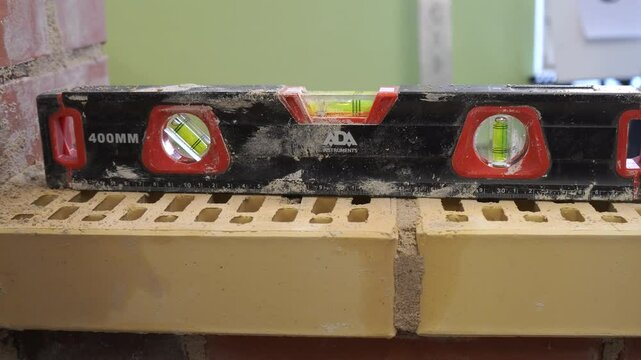 A special tool is a device for measuring the angle and flatness of the brickwork surface