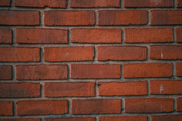 Red brick wall with a rich, warm texture
