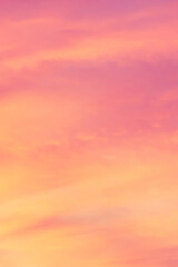 Sky with soft and fluffy pastel coral orange pink and blue colored clouds. Sunset background. Nature. sunrise. Instagram toned style
