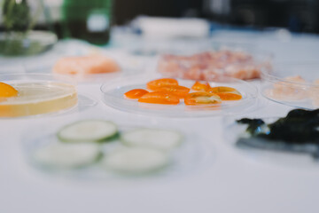 Team Asian scientists in a lab conducting food research using a microscope and lab equipment, showcasing innovation in food science and biotechnology