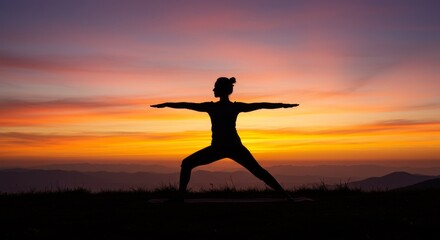 Silhouette of a person practicing yoga during a beautiful sunset