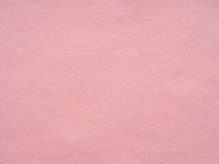 A plush tapestry of blush, woven into the soft textures of a close-up pink felt canvas