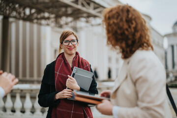 Group of professionals having a friendly discussion outside of an office setting, with a focus on collaboration and productive conversations.