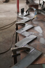 Straight flight staircase. Metal plates are welded at an angle of 90 degrees, forming steps for a modern design metal staircase.