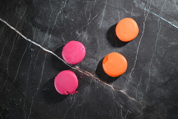 multicolored macaroons on a gray background confectionery