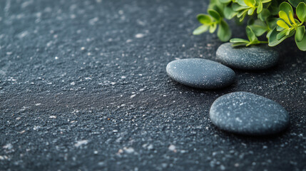 small marine black stones with free grey space on image for background or design 